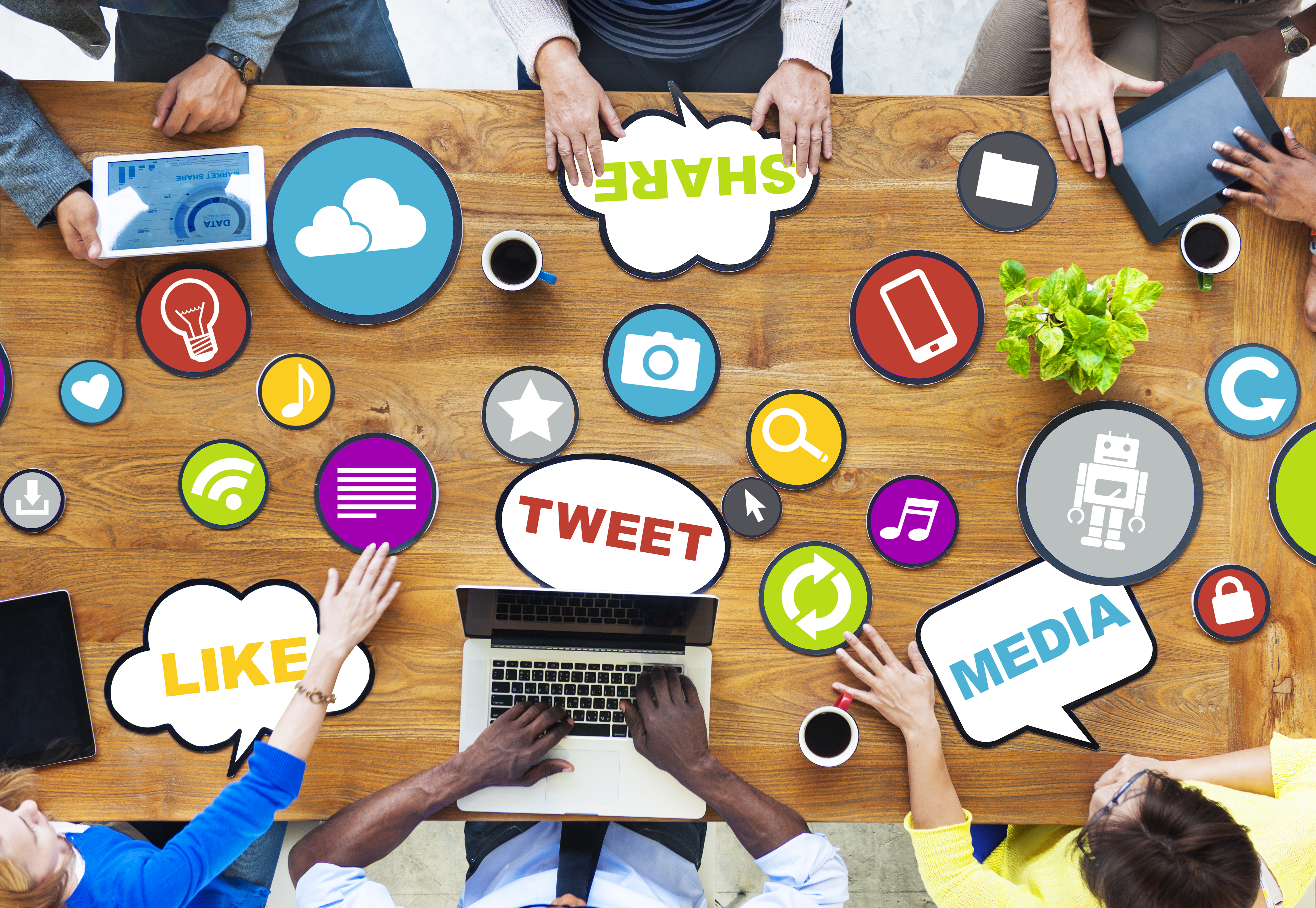 This image is a photo of a group of people collaborating and brainstorming ideas 
                which showcases that businesses must be intentional about the social media platforms they employ to reach their intended markets and customers.